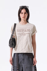 MATIN KIM LETTERING GRAFFITI CREASE TOP IN BEIGE